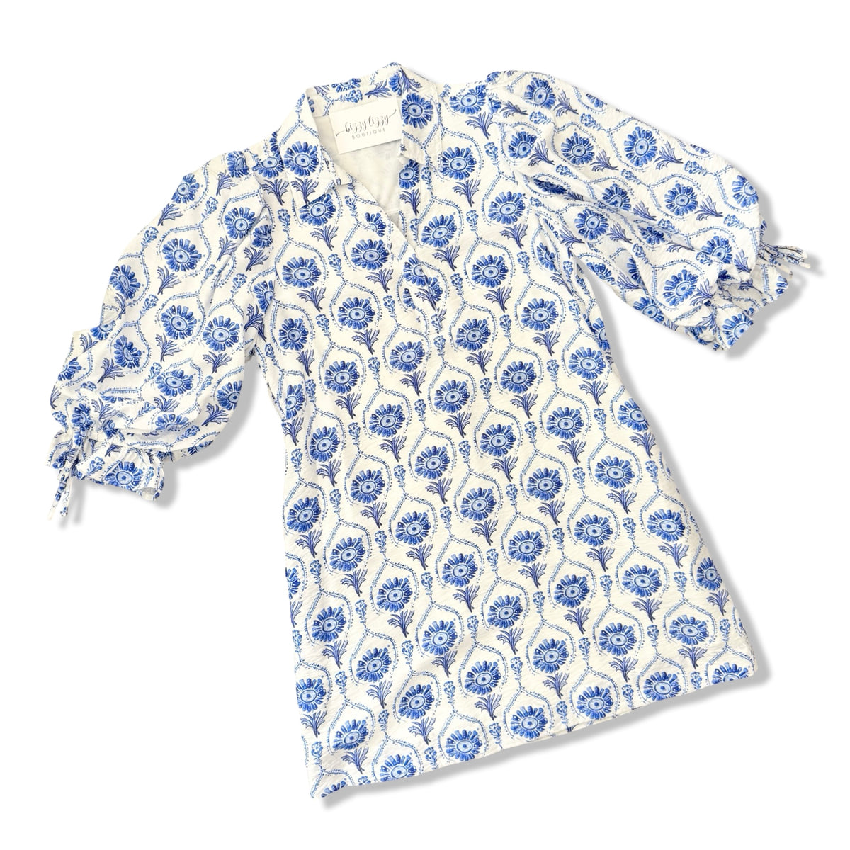 White garment with blue floral pattern on a white background