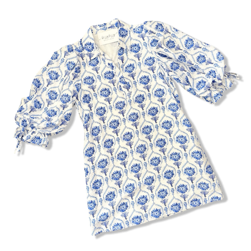 White garment with blue floral pattern on a white background