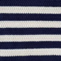 Close-up of a textured knit fabric with horizontal navy blue and off-white stripes.