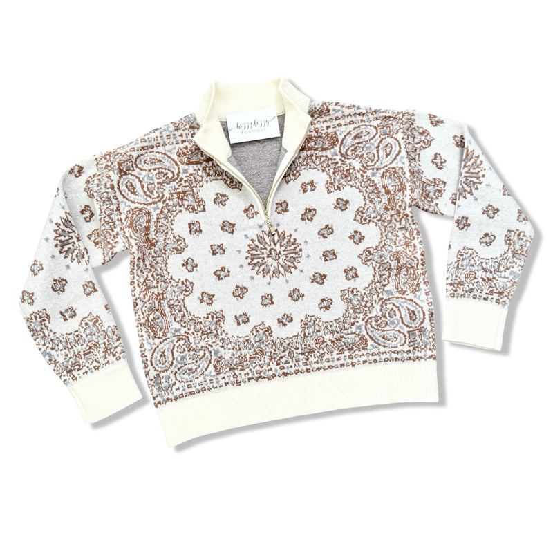 A white quarter-zip pullover sweater with a brown paisley and paisley pattern, featuring a ribbed collar, cuffs, and hem, laid flat on a white background.