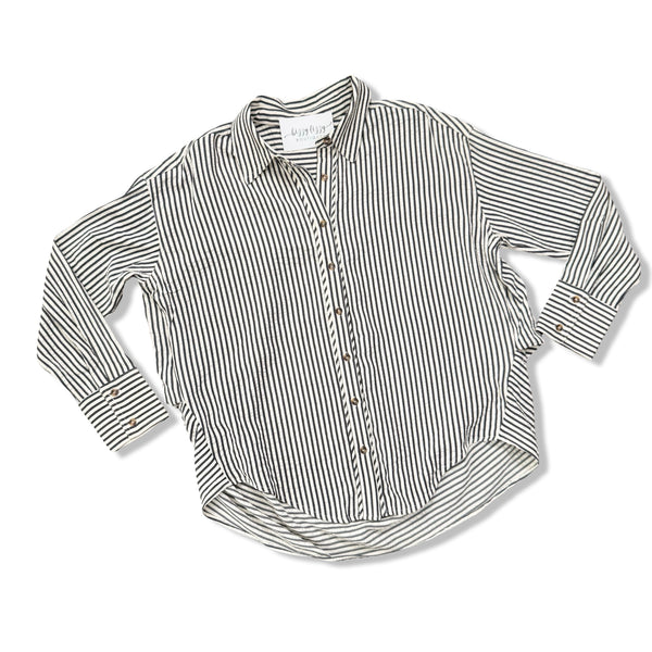 A long-sleeve button-up shirt with vertical dark blue and cream stripes, laid flat on a white background.