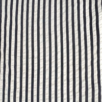 A close-up of a fabric pattern featuring vertical navy blue and off-white stripes.