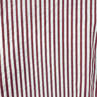 A close-up of a vertically striped fabric pattern with alternating dark burgundy red and off-white stripes.