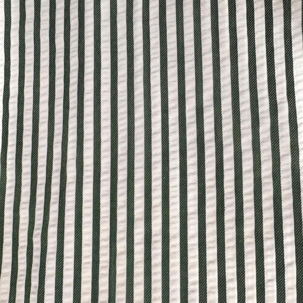 A close-up of a striped fabric pattern featuring alternating vertical stripes of dark forest green and off-white.