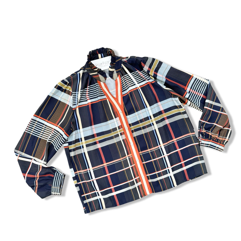 A long-sleeve plaid shirt with a navy blue base and intersecting stripes of white, red, orange, and light blue, featuring a split collar and button closure.