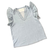 Light blue top with ruffled sleeves on a white background
