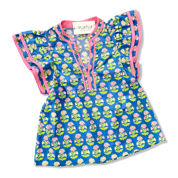 Blue Lime Green and Pink Floral top with pink trim on a white background