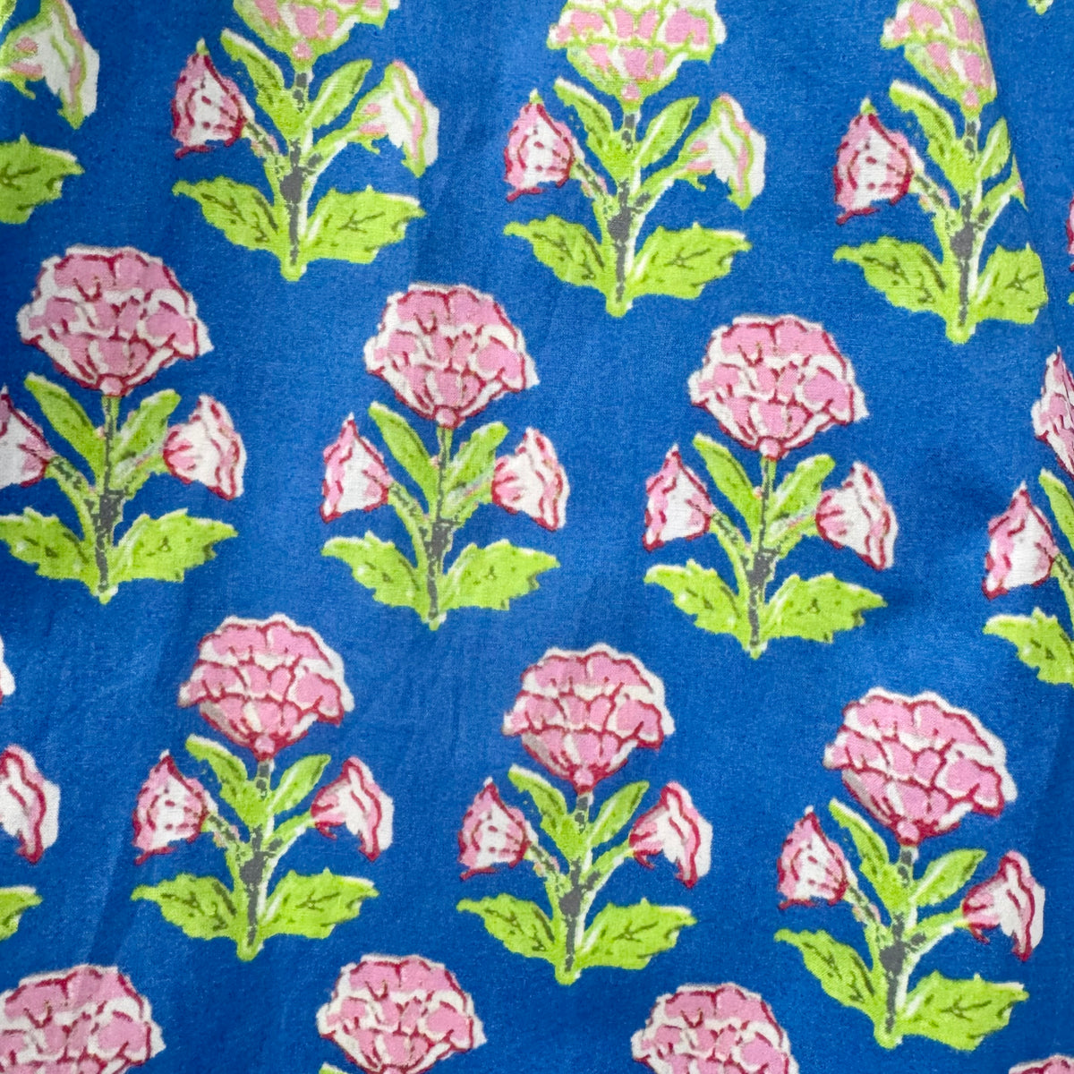 Floral pattern with pink flowers and green leaves on a blue background