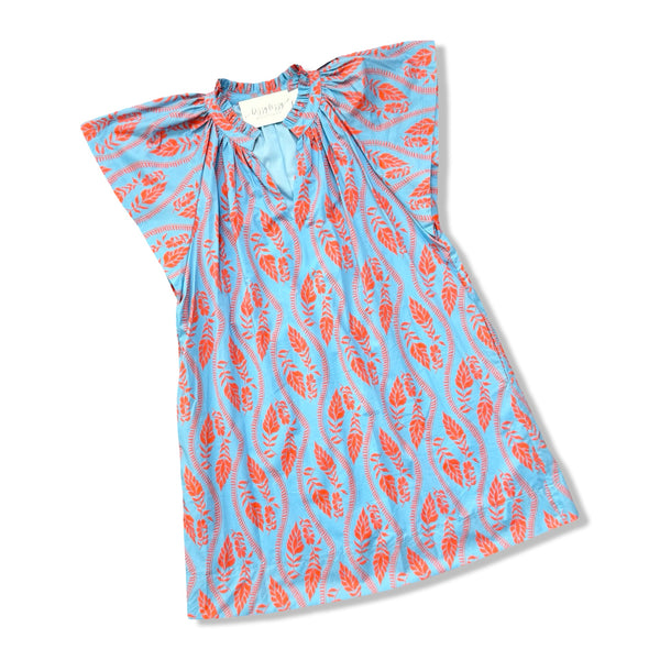 Blue dress with orange floral pattern on a white background