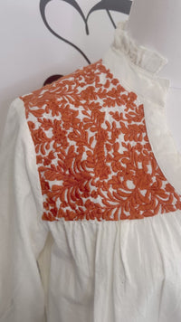 Jane Cream Orange Layerz Video close up of embroidered sleeve on mannequin